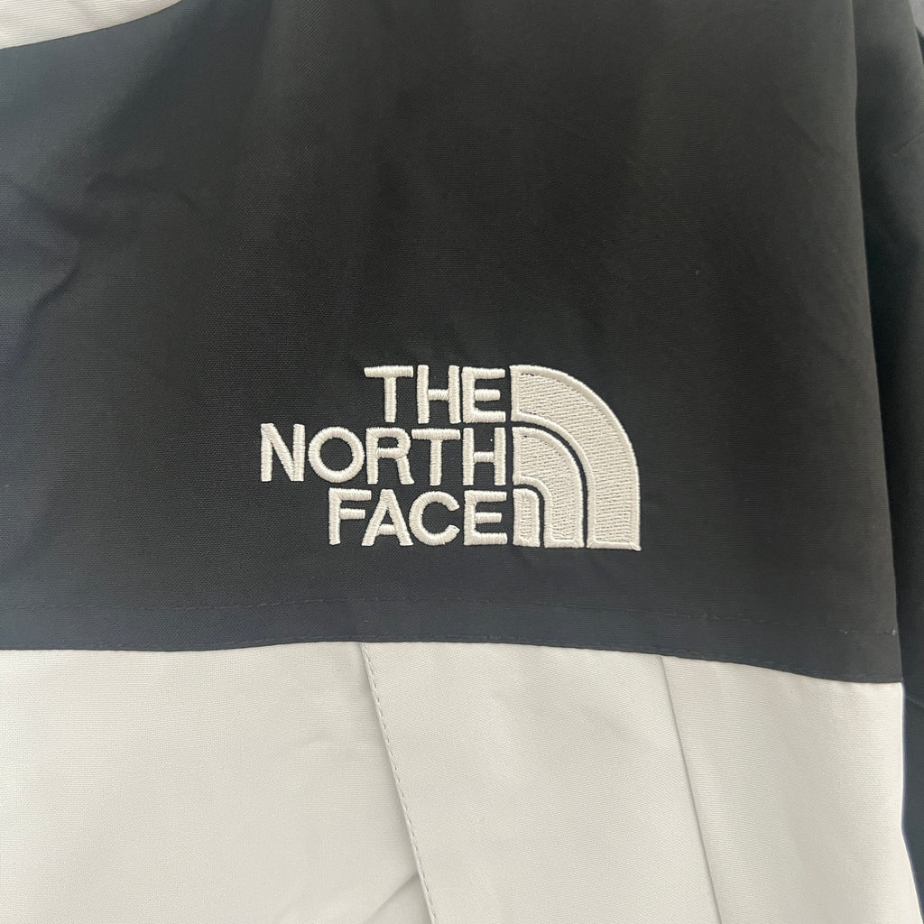 The North Face Windbreaker Weiß & Schwarz