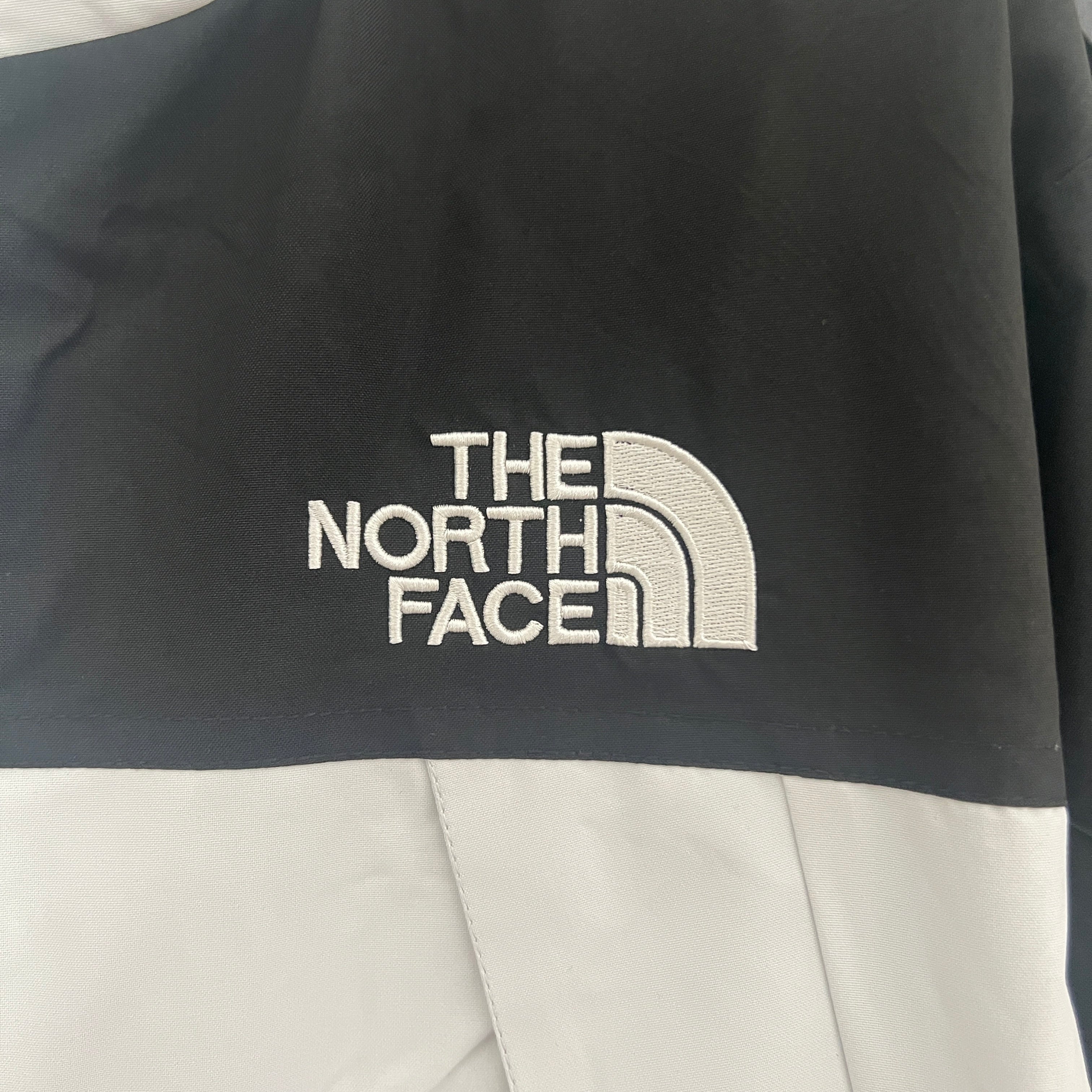 The North Face Windbreaker Weiß & Schwarz
